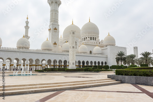 White Grand Mosque built with marble stone against blue sky, also called Sheikh Zayed Grand Mosque in Abu Dhabi, UAE