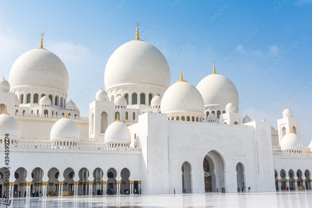 Domes of White Grand Mosque built with white marble stone, also called Sheikh Zayed Grand Mosque, inspired by Persian, Mughal and Moorish mosque architecture