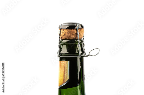 Close up of a bottle of champagne on a white background.