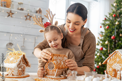 Family cooking gingerbread house photo