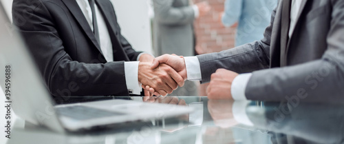 close up. handshake of business people near the office table