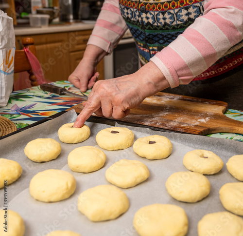 Woman preparing homemade pies at home