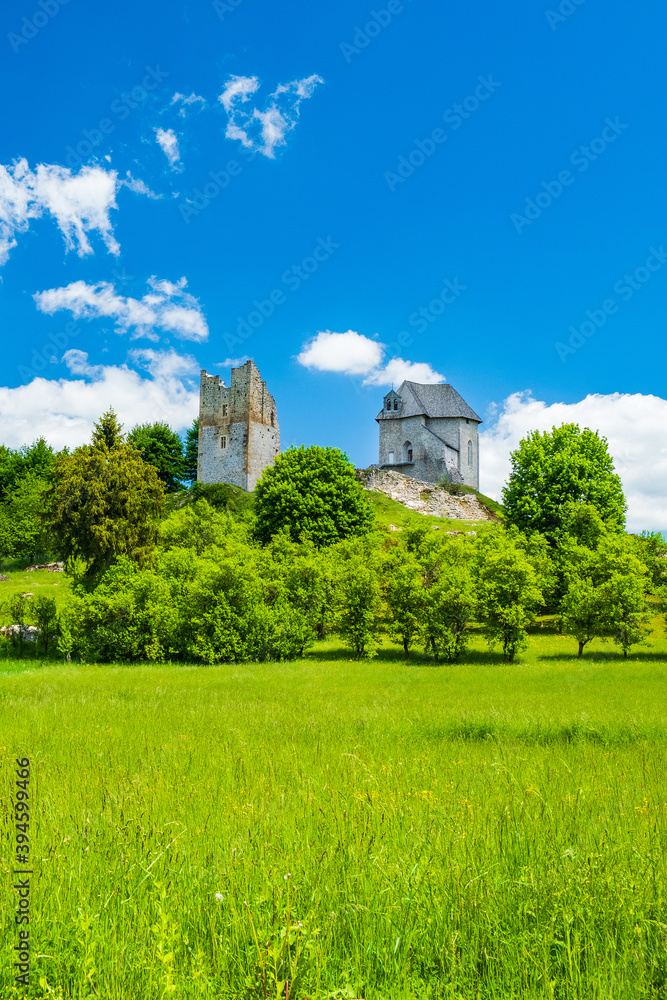 Beautiful green countryside landscape and Brinje castle ruins in Lika region of Croatia