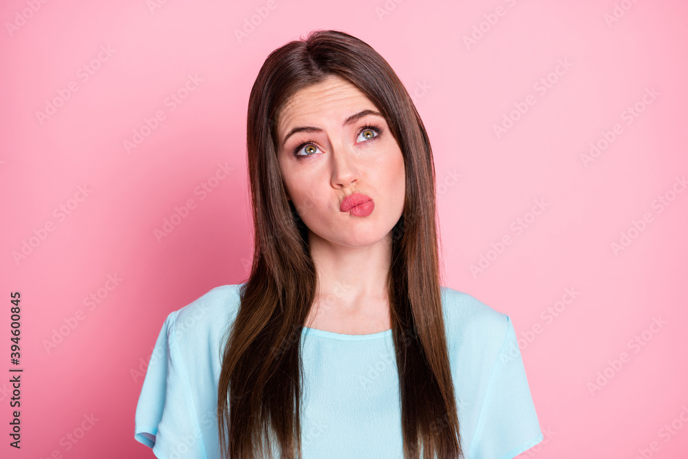 Photo of minded lady thinking look up empty space doubtful wear casual blue t-shirt isolated pink pastel color background Photo of minded lady thinking look up empty space doubtful wear casual blue t-shirt isolated pink pastel color background