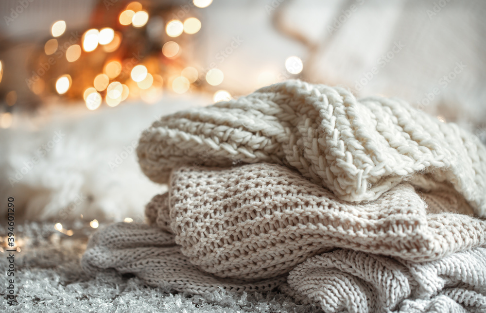 Winter background with knitted elements on a blurred background. Winter background with knitted elements on a blurred background.