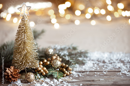 Christmas cozy background with decor details, snow and blurry lights copy space. photo