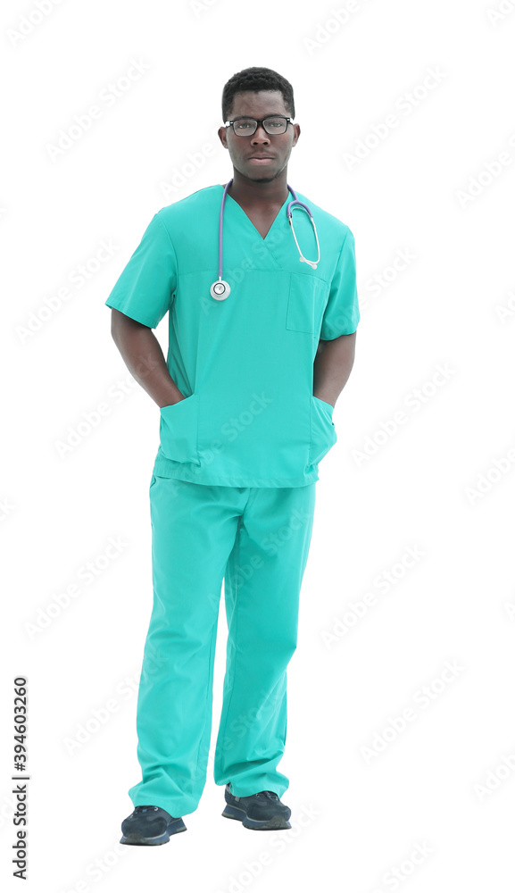 in full growth. smiling doctor in blue uniform. in full growth. smiling doctor in blue uniform.