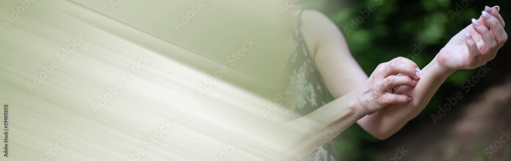 Woman scratching her arm; panoramic banner