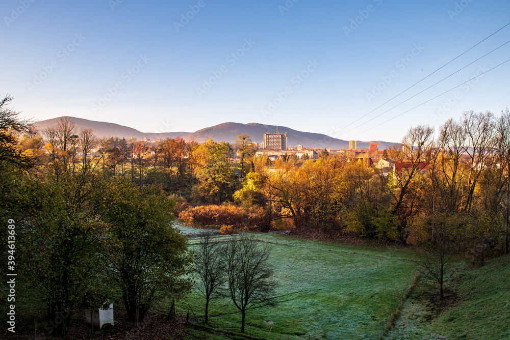 Fototapeta premium Trinec town with Maly Javorovy and Ostry hills on the background in Czech republic during autumn morning