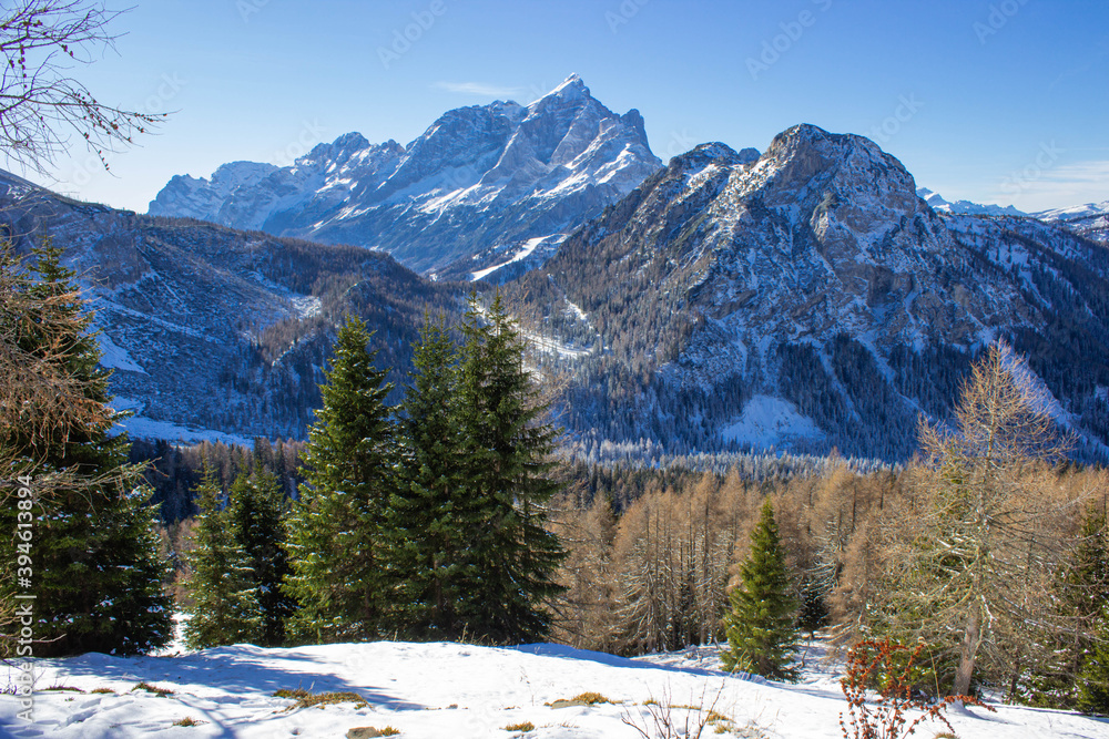 Mountain winter landscape. The first snow fell on the Dolomites. View of Monte Civetta, Italy in the unusual morning light.