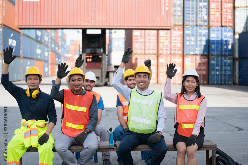 Logistics manager and worker warehouse team , transportation business Containers concept .Engineering worker professional team training a logistic or industrial warehouse. Logistics manager and worker warehouse team , transportation business Containers concept .Engineering worker professional team training a logistic or industrial warehouse.