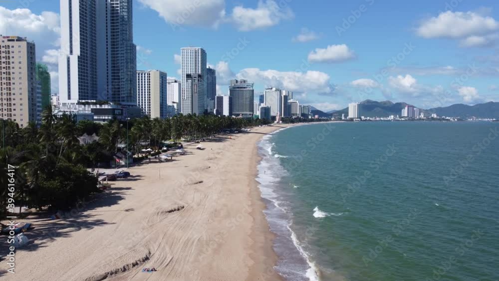 NHA TRANG, Khanh Hoa, Vietnam - November 23, 2020: Aerial view on beautiful deserted center Nha Trang beach in Vietnam with luxury hotels and holiday resorts. Travel, tourism and vacation concept. NHA TRANG, Khanh Hoa, Vietnam - November 23, 2020: Aerial view on beautiful deserted center Nha Trang beach in Vietnam with luxury hotels and holiday resorts. Travel, tourism and vacation concept.