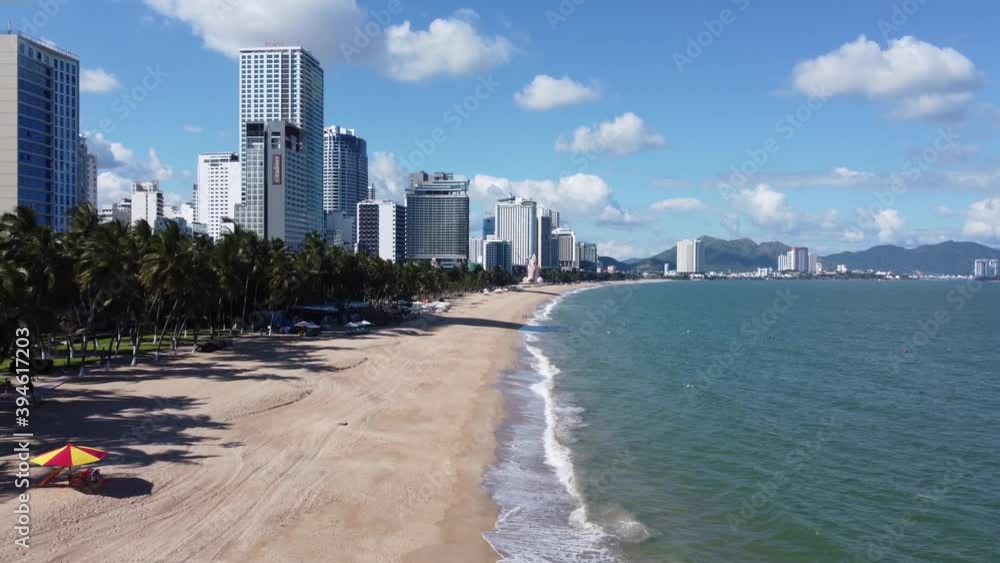 NHA TRANG, Khanh Hoa, Vietnam - November 23, 2020: Aerial view on beautiful deserted center Nha Trang beach in Vietnam with luxury hotels and holiday resorts. Travel, tourism and vacation concept. NHA TRANG, Khanh Hoa, Vietnam - November 23, 2020: Aerial view on beautiful deserted center Nha Trang beach in Vietnam with luxury hotels and holiday resorts. Travel, tourism and vacation concept.