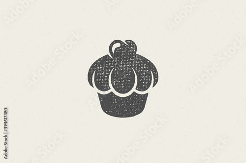 Silhouette of retro emblem of cupcake with cream as symbol for bakery hand drawn stamp effect vector illustration.