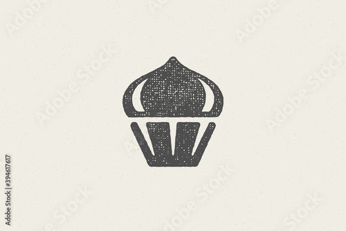 Black silhouette of fresh cupcake with cream created as icon of bakery hand drawn stamp effect vector illustration.