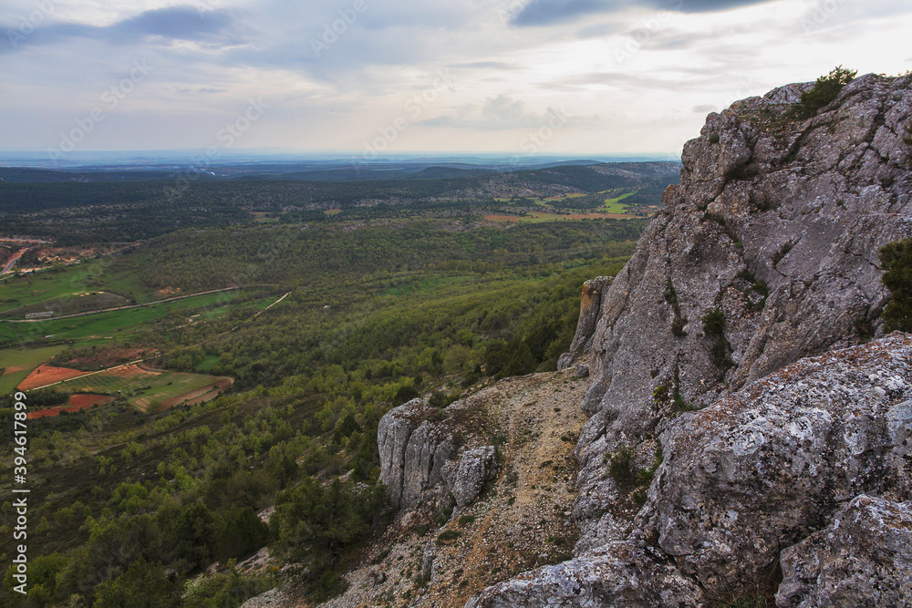 Naklejka premium Mountain top with village in the background below