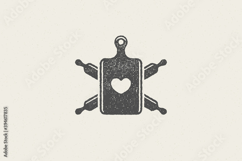 Silhouette of rolling pins crossed and cutting board with heart symbol hand drawn stamp effect vector illustration.