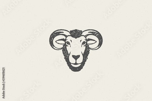Ram head with horns silhouette designed as logo for farm industry hand drawn stamp effect vector illustration.