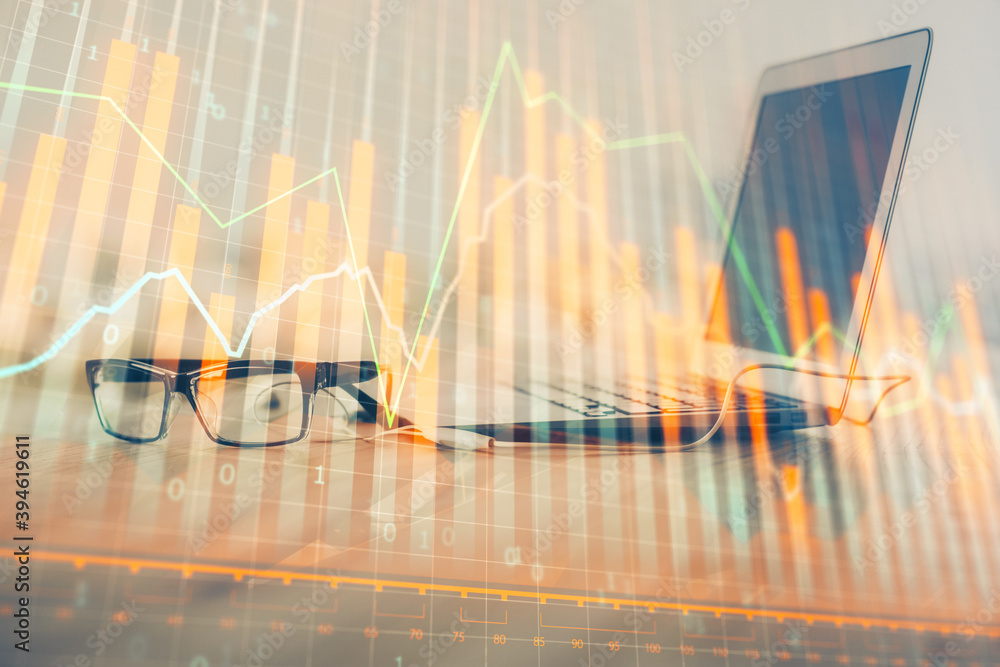 Forex Chart hologram on table with computer background. Multi exposure. Concept of financial markets. Forex Chart hologram on table with computer background. Multi exposure. Concept of financial markets.