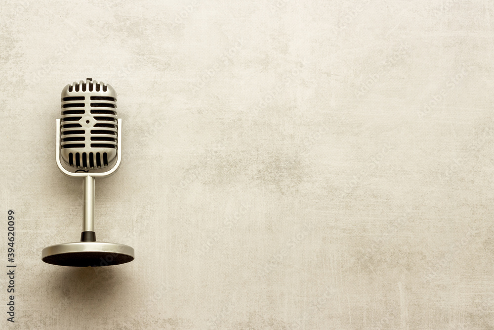 Fototapeta premium Retro style microphone. Aydio recording background. Top view
