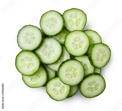 A pile of cucumber slices isolated on white background.