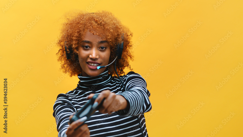 African american black woman with headset professional gamer playing video games using joystick . High quality photo