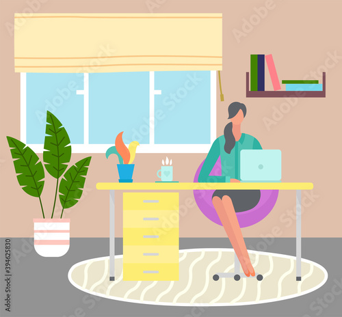 Young woman works on laptop remotely. Distance job. Self-organization and time management. Interior home design, homeplant on floor. Book shelf. Stay home and be safe. Coronavirus self-isolation.