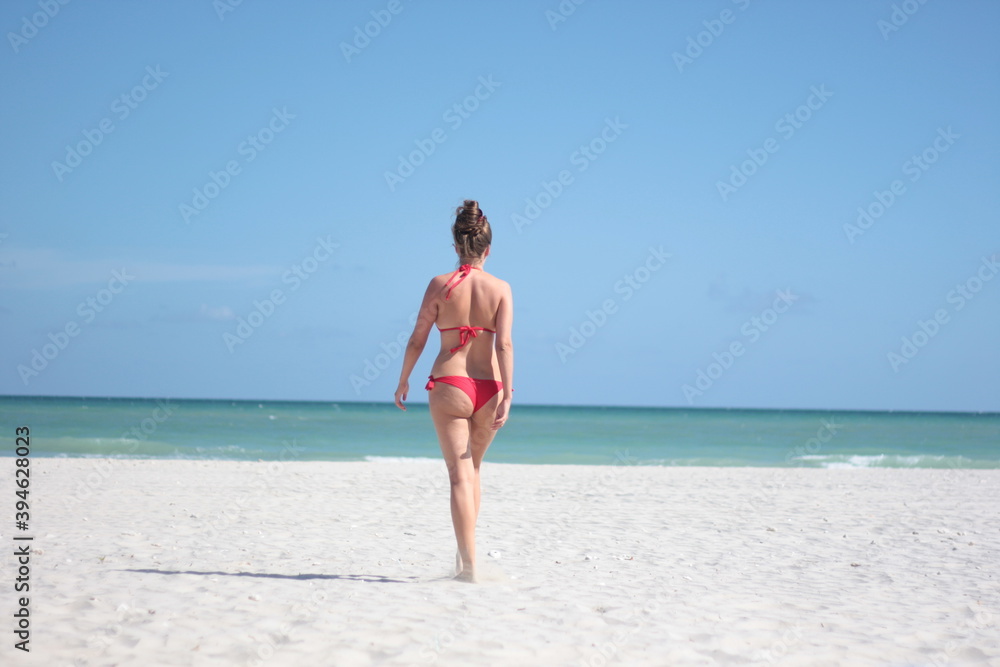 Girl in red bikini back view