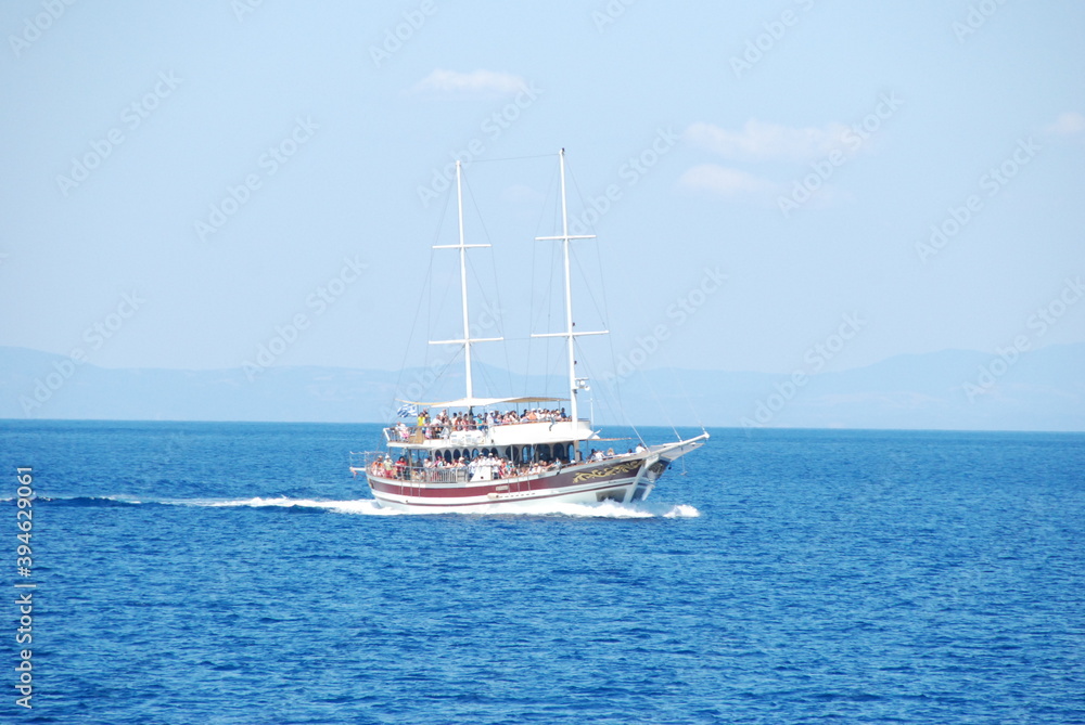 a small boat transports tourists