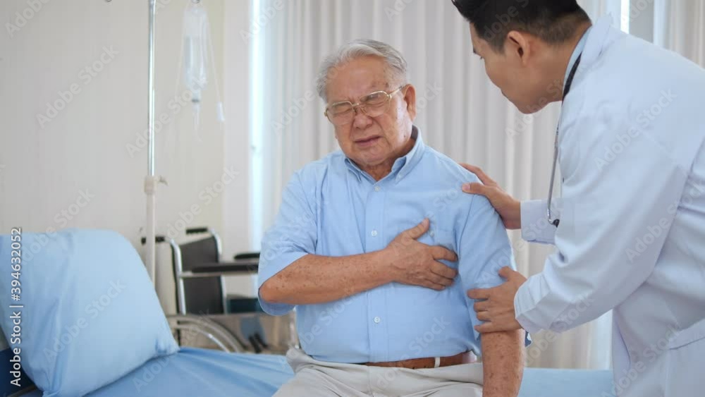 Elderly Asian man with chest pain suffering from heart attack. Man clutching his chest from acute pain. Heart attack symptom-Healthcare and medical concept. Elderly Asian man with chest pain suffering from heart attack. Man clutching his chest from acute pain. Heart attack symptom-Healthcare and medical concept.