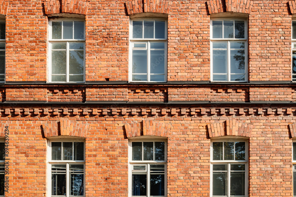 Fototapeta premium Beautiful vintage red brick building at sunny day