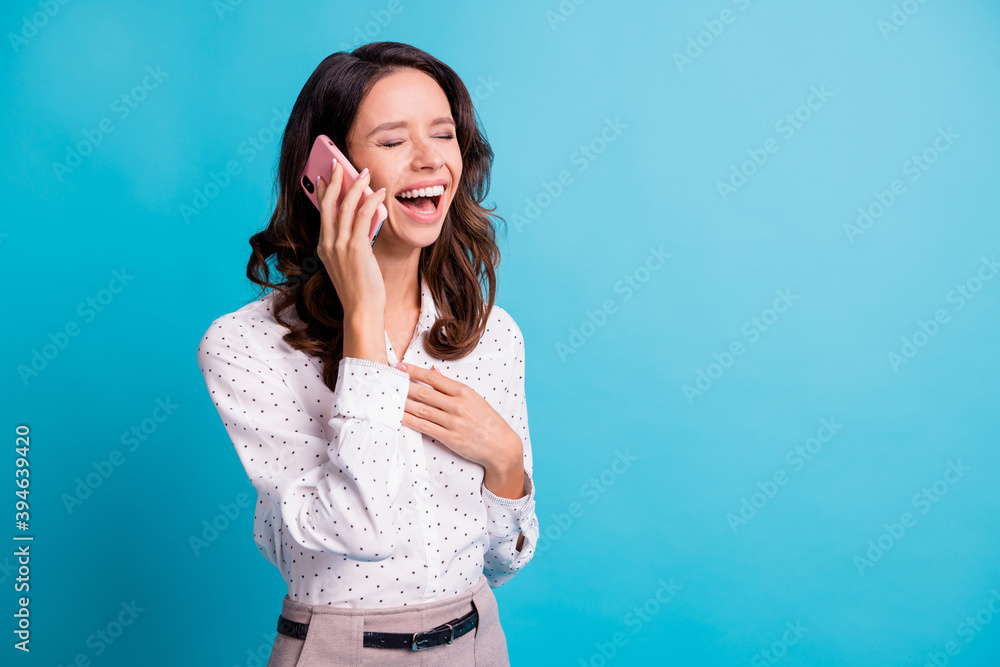 Profile photo of optimistic brunette girl talk telephone laugh near empty space wear shirt isolated on teal color background Profile photo of optimistic brunette girl talk telephone laugh near empty space wear shirt isolated on teal color background
