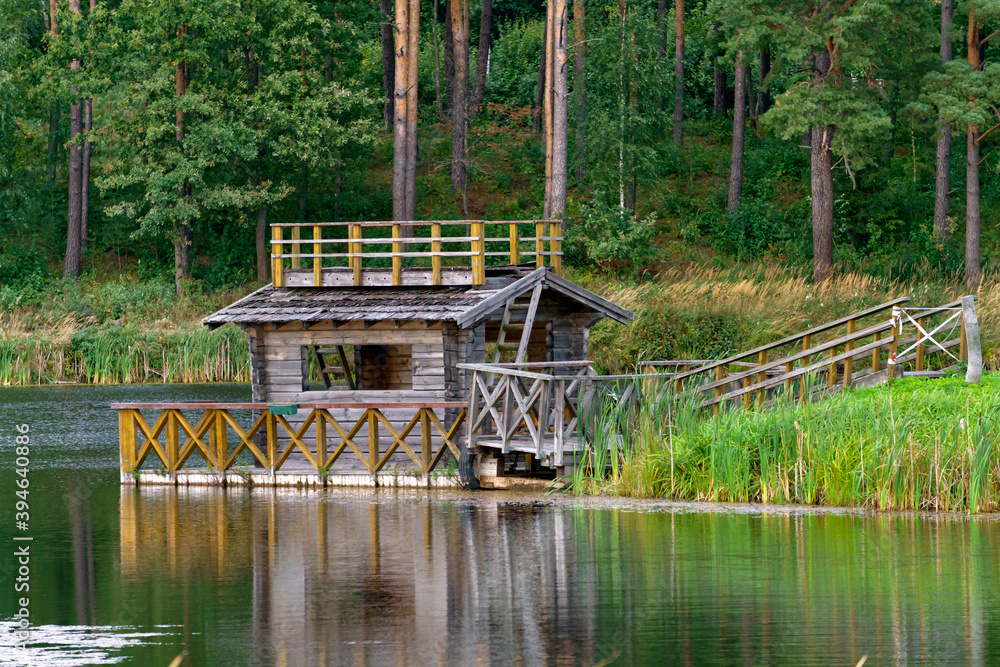 A small wooden house for fishermen on the shore of the lake.