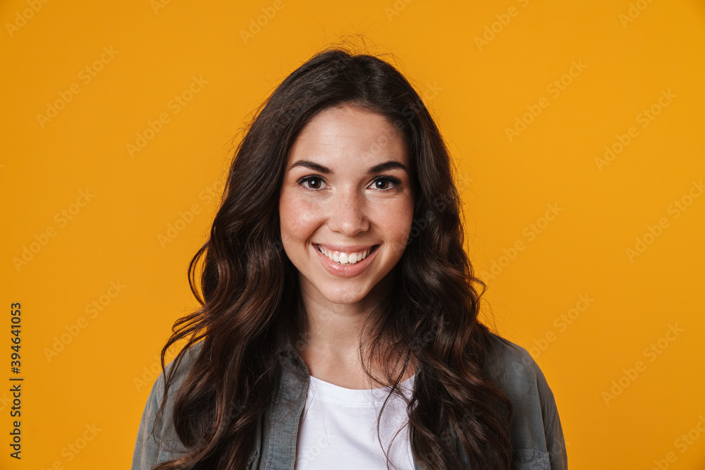 Cheerful beautiful girl posing and smiling on camera Cheerful beautiful girl posing and smiling on camera