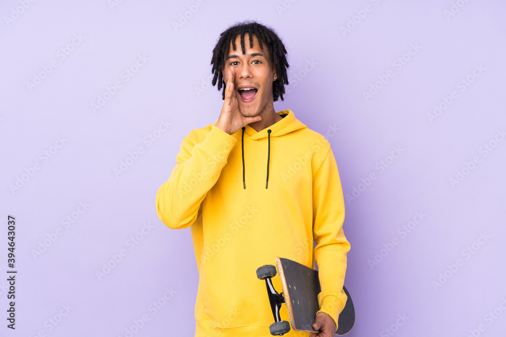 Handsome young skater man over isolated wall shouting with mouth wide open Handsome young skater man over isolated wall shouting with mouth wide open