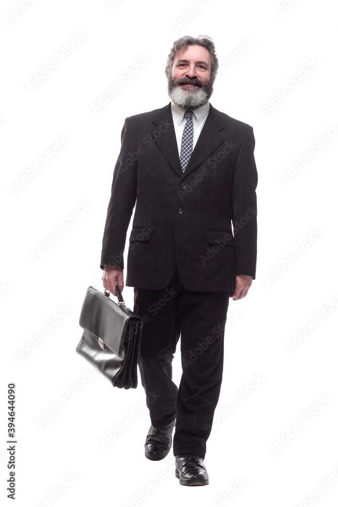 in full growth. smiling business man striding forward in full growth. smiling business man striding forward