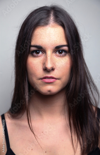 Beautiful young woman portrait, Studio shot isolated on grey background