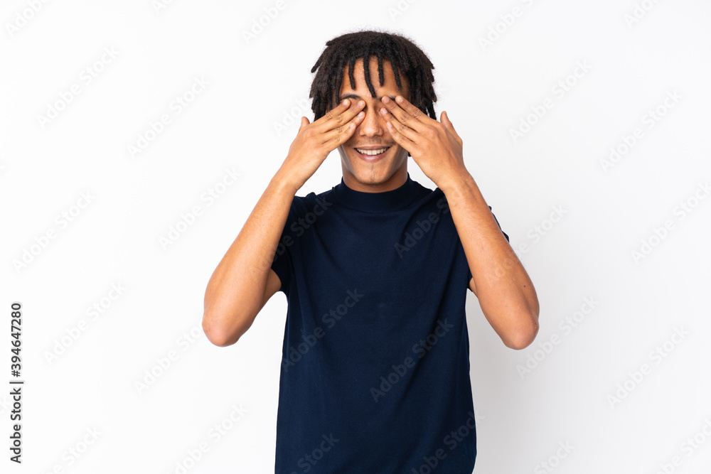 Young african american man isolated on white background covering eyes by hands Young african american man isolated on white background covering eyes by hands
