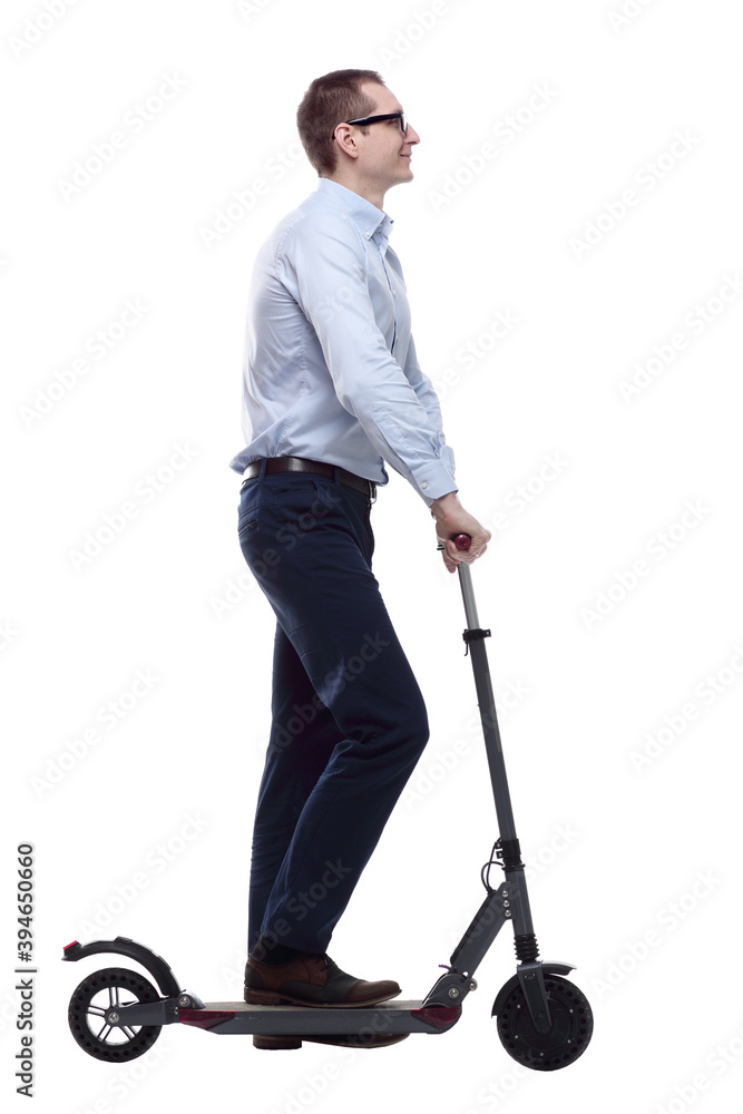 side view. casual man with electric scooter looking at you side view. casual man with electric scooter looking at you