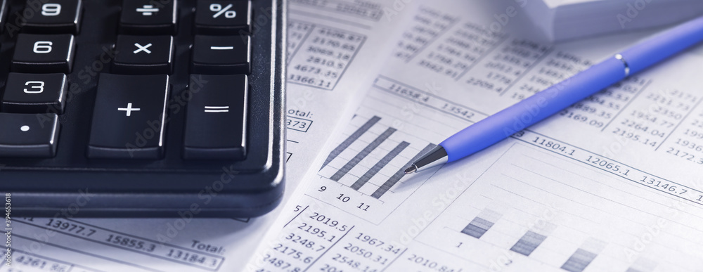 accounting document with pen and calculator. Concept of banking, financial report and financial audit. accounting document with pen and calculator. Concept of banking, financial report and financial audit.