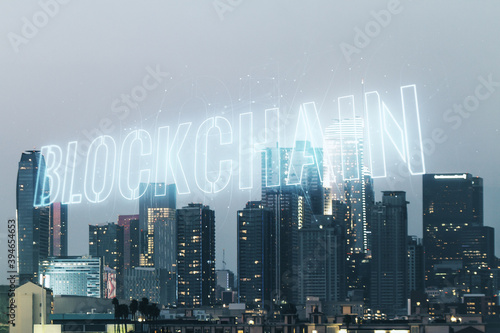 Abstract virtual blockchain technology sketch on Los Angeles office buildings background, future technology and blockchain concept. Double exposure