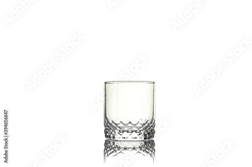 Empty glass for whiskey isolated on white