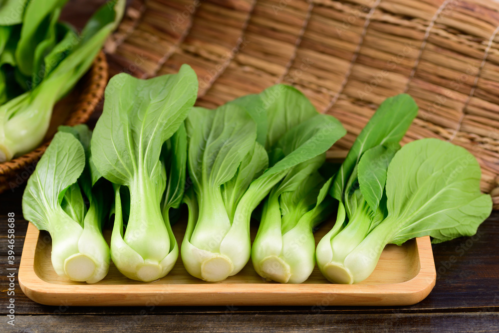 Fresh Bok Choy or Pak Choi (Chinese cabbage) on wooden tray, Organic vegetables Fresh Bok Choy or Pak Choi (Chinese cabbage) on wooden tray, Organic vegetables