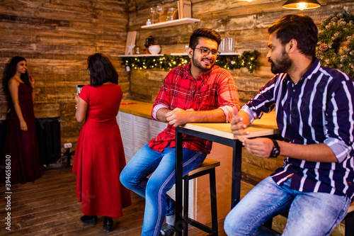 indian people sitting in cafe feeling loneliness but try to be happy