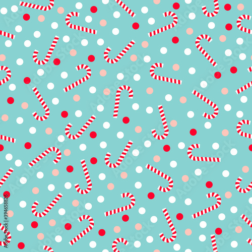 Christmas candy canes and confetti seamless pattern on pastel blue background.
