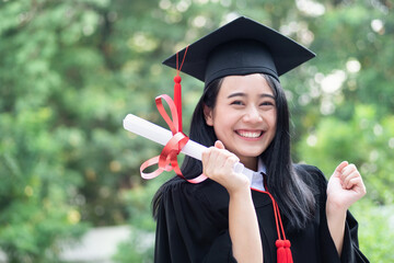 happy excited college student graduating; concept of successful education, happy commencement day, woman education equality, employment opportunity, high education degree, overseas study scholarships