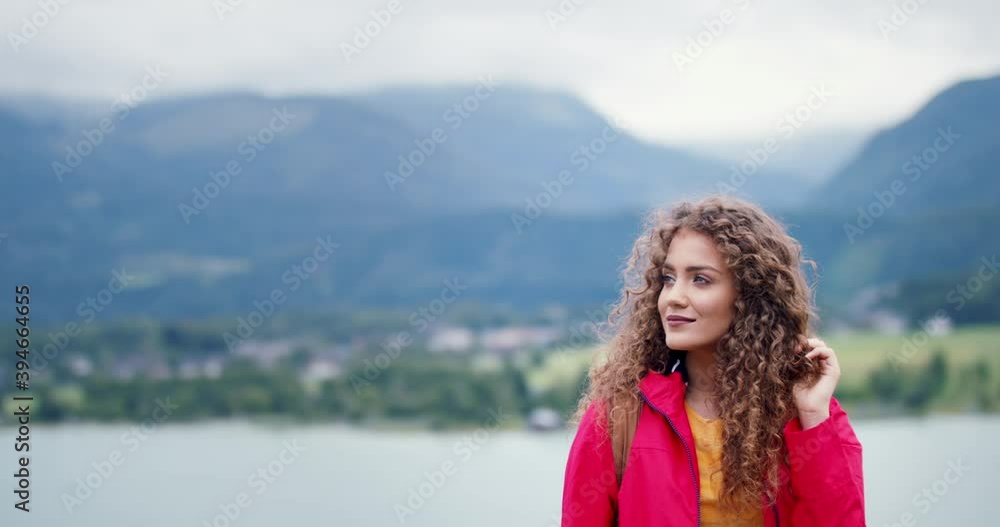 Young woman tourist with a backpack on a hiking trip in nature, walking. Young woman tourist with a backpack on a hiking trip in nature, walking.