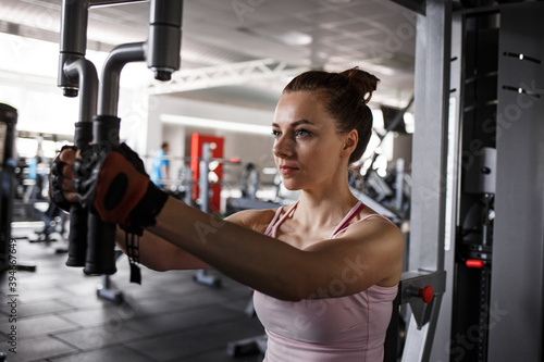 Young fitness woman working out in gym