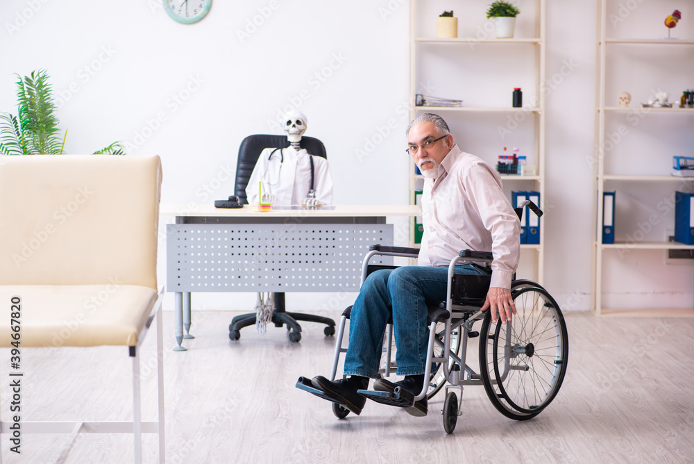 Old man in wheel-chair visiting dead doctor