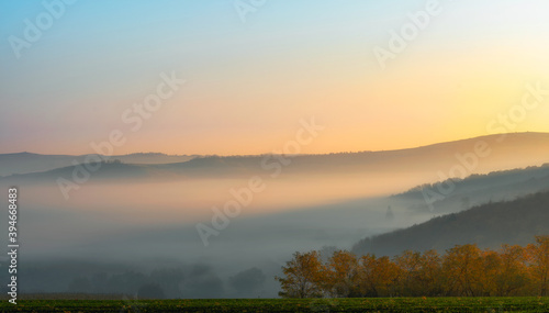 Autumn misty morning in the hills, autumn time 